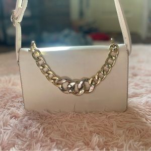 Selling this white hand bag used had it for a while.